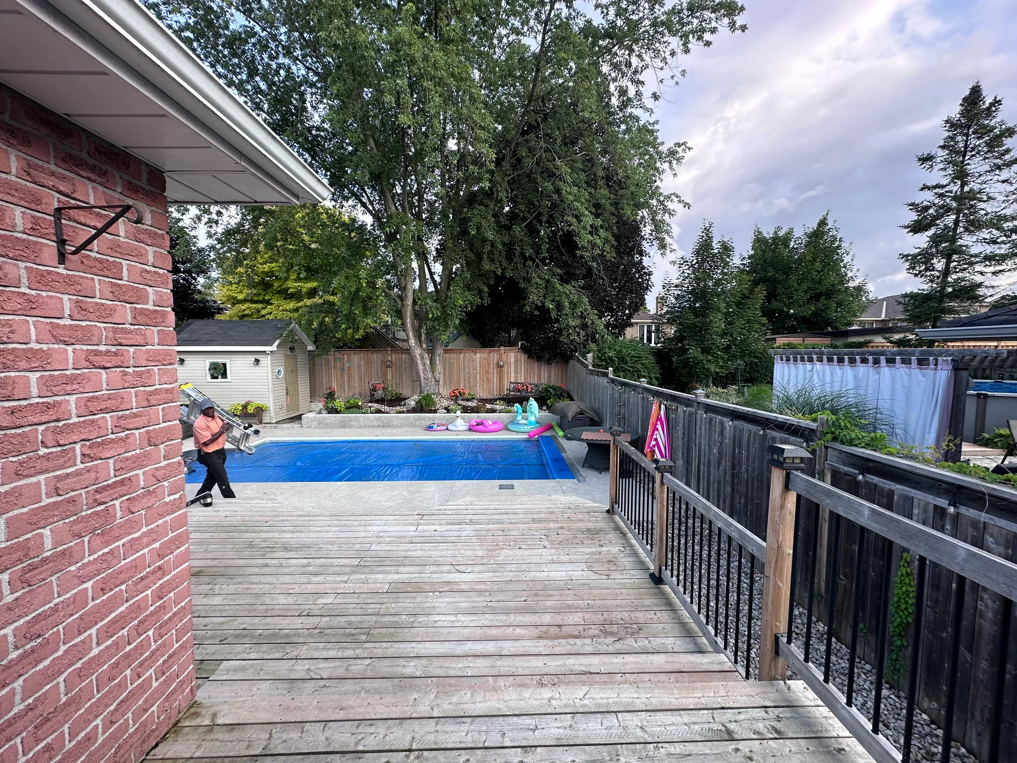 Backyard deck overlooking a swimming pool